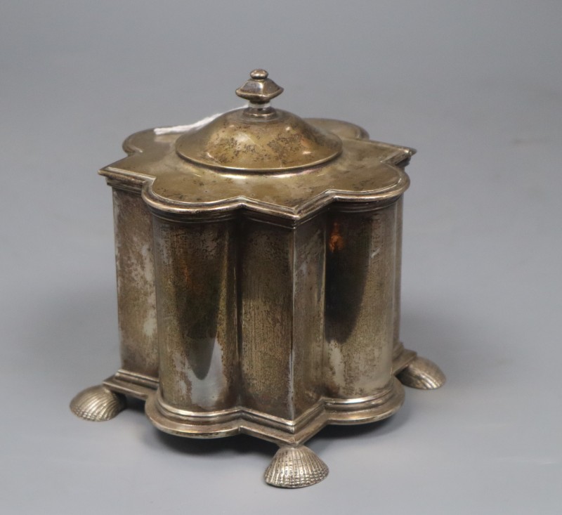 A George V silver tea caddy, of lobed form,on shell feet, Pairpoint Brothers, London, 1911, 12.5cm, 16 oz.